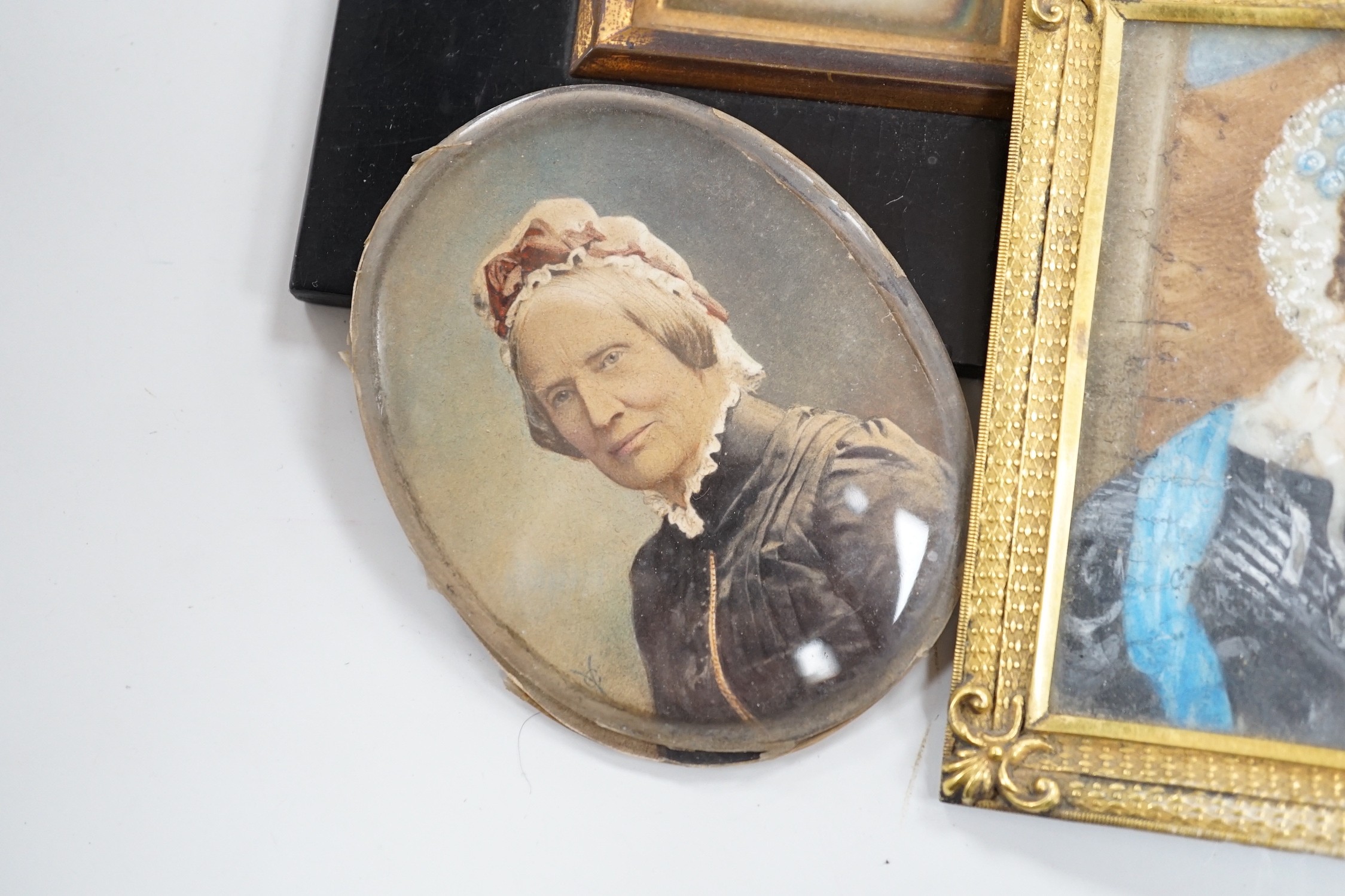 Continental School, 18th century, portrait miniature on ivory, Portrait of a Lady in a red dress, together with six other portraits. To include the subject of military interest: a portrait watercolour of General Isaac Br